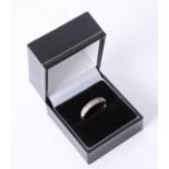 An 18ct white gold ring set with seven stones, approx 3.60gms.
