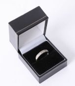 An 18ct white gold ring set with seven stones, approx 3.60gms.