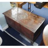 Small antique carved oak coffer the top decorated with a thistle, width 90cm.