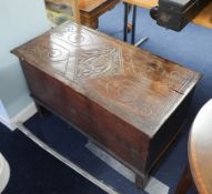 Small antique carved oak coffer the top decorated with a thistle, width 90cm.