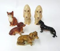 Two Sylvac dogs, and a Beswick cat, and three other animal ornaments.