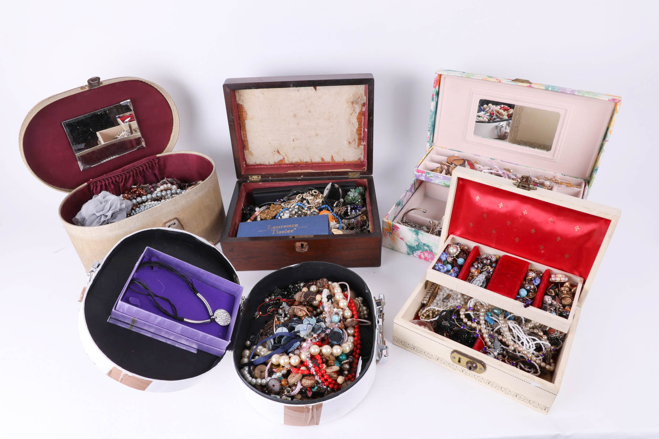 A large quantity of costume jewellery in various jewellery boxes.