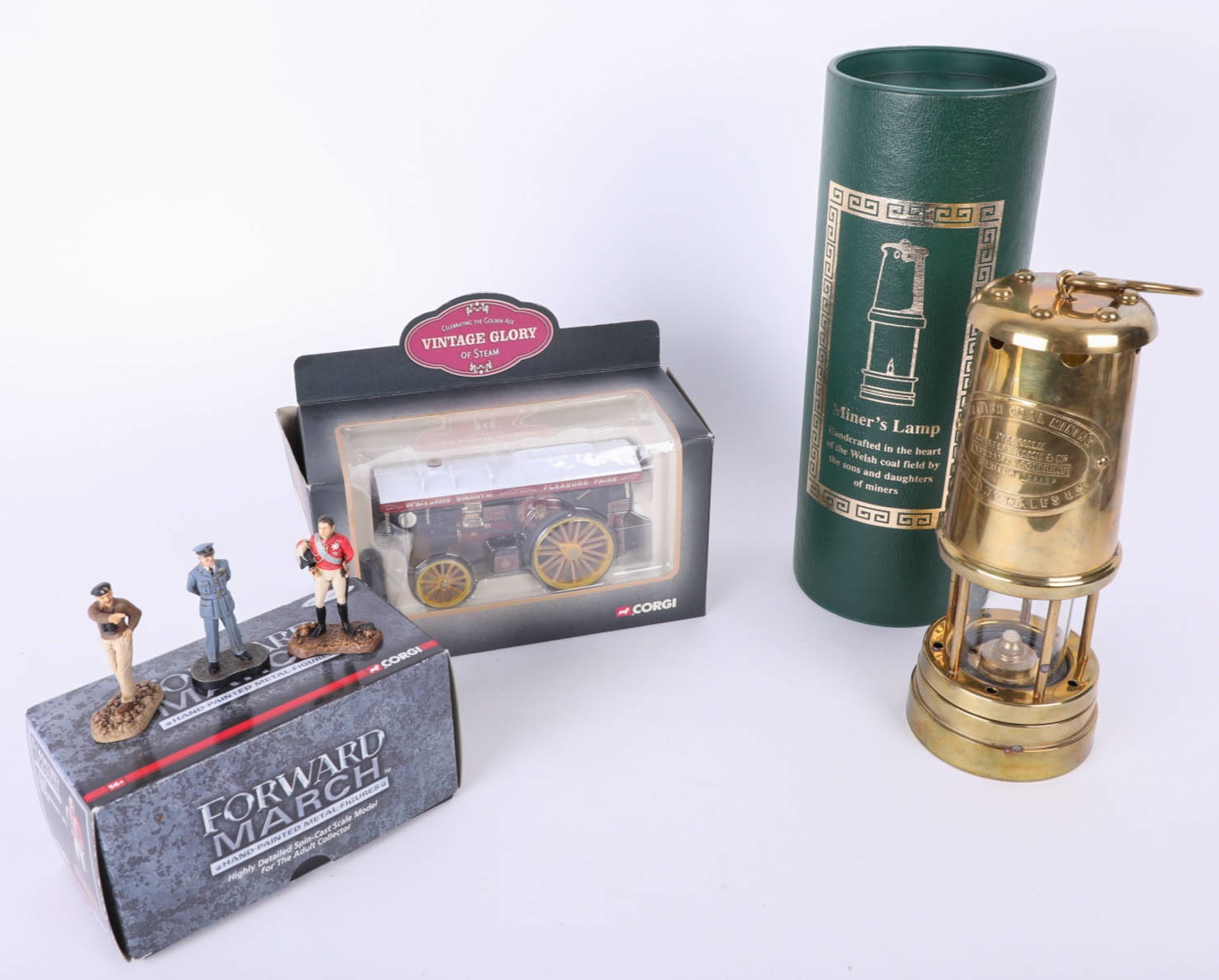 Three Corgi metal Forward March figures, Corgi vintage steam engine and a replica miners lamp all