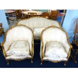 A 19th century Italian style gilt wood framed saloon suite, comprising settee and two armchairs, (ex