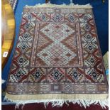 A 20th century Afghan silk rug, (Arabic motif), 90cm x 140cm.