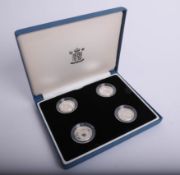 Royal Mint, a set of four UK silver proof pattern coins, boxed.