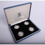 Royal Mint, a set of four UK silver proof pattern coins, boxed.