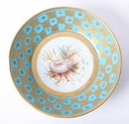 An 18th century French Vincennes porcelain dish decorated with gilt work and shells on a turquoise