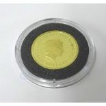 A Perth Mint Australian 2013 gold sovereign.