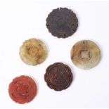 Five carved jade medallions, the largest 55mm diameter.