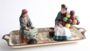 Two Royal Doulton figures, 'The Old Balloon Seller' and 'Fortune Teller', and a Royal Doulton