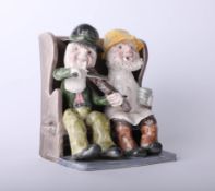 Alan Young Pottery, figures on a bench, height 15cm.