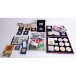 Collection of various commemorative coins including silver crown, Bradford Exchange, First Day Cover