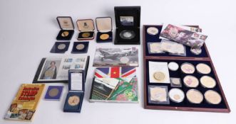 Collection of various commemorative coins including silver crown, Bradford Exchange, First Day Cover