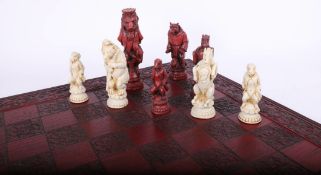 Modern chess set with moulded figures modelled in the form of Alice in Wonderland?