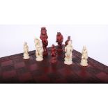 Modern chess set with moulded figures modelled in the form of Alice in Wonderland?
