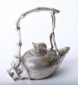 Chinese white metal teapot with character marks to base with faux bamboo handle, 20th century,