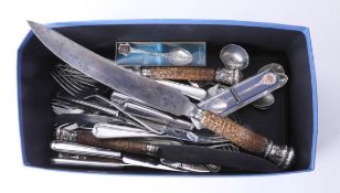 Assortment of various silver plated flatware together with a three piece carving set with ornate