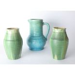 A pair of Candy ware drip glaze green pottery vases together with Art pottery blue jug.