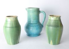 A pair of Candy ware drip glaze green pottery vases together with Art pottery blue jug.