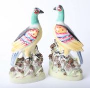 Pair of Staffordshire figures of peacocks, height 27cm