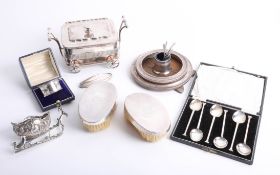 A boxed silver napkin ring, set of six silver teaspoon, pair of silver backed brushes, two