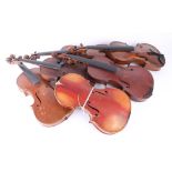 Six various vintage violins, some missing necks.