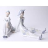 Two Lladro figures seated Harlequin and Columbine, boxed, height 20cm.