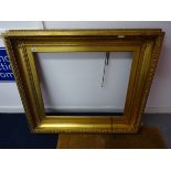 Large gilt frame.