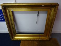 Large gilt frame.