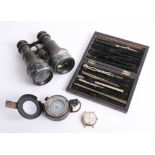 A set of vintage drawing instruments in a rosewood case, a military compass marked T.G Co. London, a