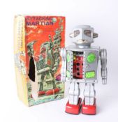 Attacking Martian battery operated tinplate toy, boxed.