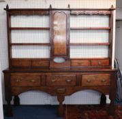 A Georgian Welsh oak open rack dresser (two sections) width 191cm.