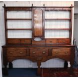 A Georgian Welsh oak open rack dresser (two sections) width 191cm.