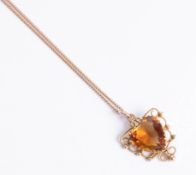 A citrine heart shaped pendant and chain.