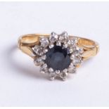 An 18ct sapphire and diamond 13 stone cluster ring, size K.