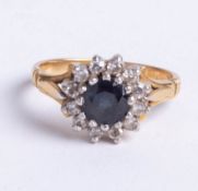 An 18ct sapphire and diamond 13 stone cluster ring, size K.