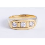 An 18ct yellow gold diamond three stone ring, approx 60 pts, size U.