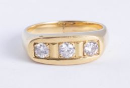 An 18ct yellow gold diamond three stone ring, approx 60 pts, size U.