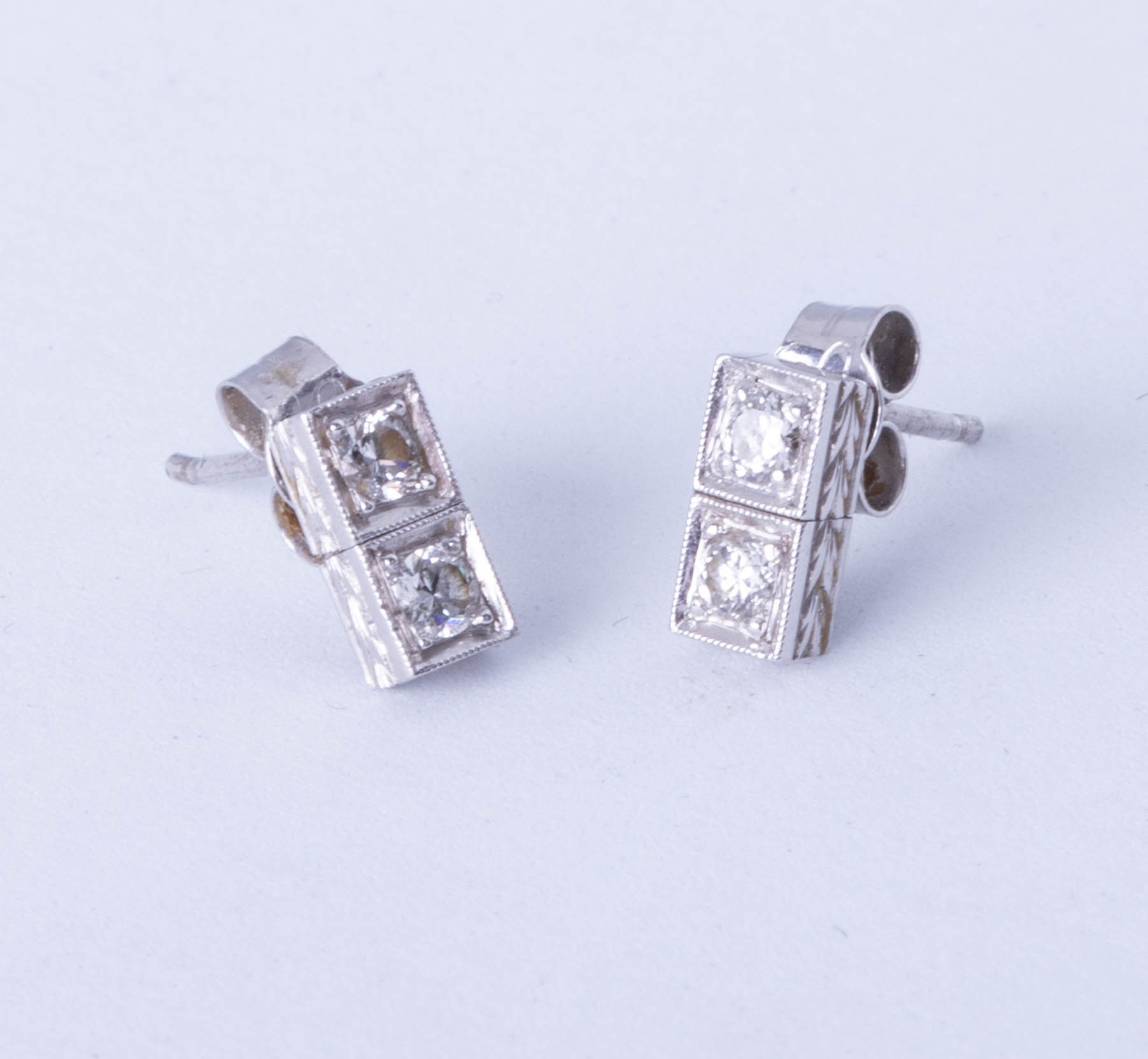 A pair platinum and diamonds set earrings,