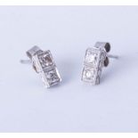 A pair platinum and diamonds set earrings,