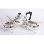 A Geo V silver three piece tea service, Walker & Hall, approx 42.60 oz.