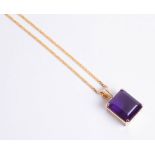 Single stone rectangular cut amethyst pendant, mounted in a plain 18ct yellow gold claw setting