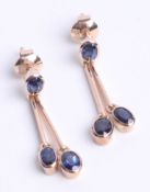 A pair 9ct gold and sapphire drop earrings.