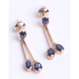 A pair 9ct gold and sapphire drop earrings.