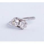 A diamond two stone cross over ring, total weight approx one carat plus, size O (thin band).