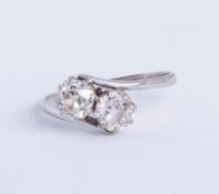 A diamond two stone cross over ring, total weight approx one carat plus, size O (thin band).