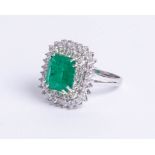An emerald and diamond cushion shape