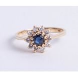 A 14ct (marked 585) sapphire and diamond cluster ring, approx 25 points, size J.