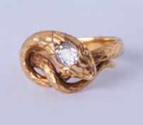 An antique diamond set snake ring, unmarked, size L.